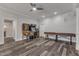 Fun game room featuring pinball machines, a shuffleboard table, and modern flooring at 116 Palermo Ct, Apex, NC 27539
