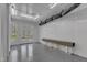 Clean garage space features a folding table and doors leading to the backyard area at 116 Palermo Ct, Apex, NC 27539