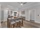 Well-equipped kitchenette with white cabinets, open shelving, granite countertops, and a cozy dining area at 116 Palermo Ct, Apex, NC 27539