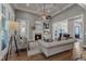 Spacious living room features a fireplace, ceiling fan, and elegant decor for a cozy and inviting atmosphere at 116 Palermo Ct, Apex, NC 27539