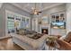 Bright living room featuring a fireplace, built-in shelving, coffered ceilings, and comfortable seating for relaxation at 116 Palermo Ct, Apex, NC 27539