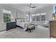 Bright main bedroom with multiple windows, neutral decor, and a comfortable sitting area at 116 Palermo Ct, Apex, NC 27539