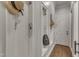 Well organized mudroom with ample storage and decorative hooks at 116 Palermo Ct, Apex, NC 27539