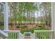 Lush backyard with manicured lawn, mature trees, and a beautiful landscape creating a serene outdoor space at 119 Faison Rd, Chapel Hill, NC 27517