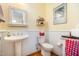 Bathroom featuring a pedestal sink, toilet, and neutral decor at 119 Faison Rd, Chapel Hill, NC 27517