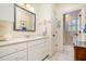 Bright bathroom features a vanity, a mirror, and a doorway to another room at 119 Faison Rd, Chapel Hill, NC 27517