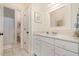 Bright bathroom features a vanity, a mirror, and a doorway to the toilet at 119 Faison Rd, Chapel Hill, NC 27517