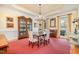 Formal dining room featuring classic decor, a chandelier, and large windows, perfect for elegant gatherings at 119 Faison Rd, Chapel Hill, NC 27517