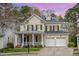 Beautiful two-story home with a covered front porch, a two-car garage, and manicured landscaping at 119 Faison Rd, Chapel Hill, NC 27517