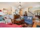 Open-concept living area with hardwood floors, a decorative rug, and views of the kitchen and dining areas at 119 Faison Rd, Chapel Hill, NC 27517