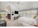 Spacious main bedroom with a sloped ceiling, a ceiling fan, and windows with shutters at 119 Faison Rd, Chapel Hill, NC 27517