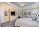 Calm main bedroom featuring a white bed, sitting area, and many windows at 119 Faison Rd, Chapel Hill, NC 27517