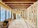 Spacious living room during construction phase, showcasing the framework and window placement at 1218 Kingwood Dr, Raleigh, NC 27609