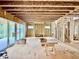 Open-concept living room in construction phase, showing framework, windows and stairs at 1218 Kingwood Dr, Raleigh, NC 27609