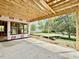 Spacious covered patio featuring a concrete base and wood beam roof, perfect for outdoor living at 1218 Kingwood Dr, Raleigh, NC 27609