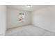 Cozy bedroom with soft carpeting and natural light from a window at 1427 Goldsboro Ave, Sanford, NC 27330