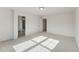 Spacious bedroom with neutral carpet, walk-in closet, and an ensuite bathroom at 1427 Goldsboro Ave, Sanford, NC 27330