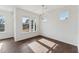 Bright dining room showcases wood floors and a chandelier, perfect for entertaining at 1427 Goldsboro Ave, Sanford, NC 27330