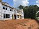 New construction townhomes showcasing the framing process in a developing neighborhood at 1427 Goldsboro Ave, Sanford, NC 27330