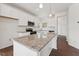 Bright kitchen with stainless steel appliances, granite countertops, and a large center island at 1427 Goldsboro Ave, Sanford, NC 27330