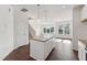 Modern kitchen with center island, pendant lights, white cabinets, and stainless appliances at 1427 Goldsboro Ave, Sanford, NC 27330