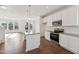 Contemporary kitchen with white cabinets, stainless steel appliances, and granite countertops at 1427 Goldsboro Ave, Sanford, NC 27330
