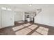 Open-concept living space with hardwood floors flows into the modern kitchen and dining area at 1427 Goldsboro Ave, Sanford, NC 27330