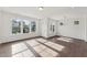 Spacious living room with ample windows providing natural light and hardwood flooring at 1427 Goldsboro Ave, Sanford, NC 27330