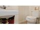Modest bathroom featuring a standard white toilet and small sink at 1431 Cherrycrest Dr, Durham, NC 27704