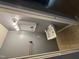 Functional bathroom featuring a wall-mounted sink and a well-lit mirror at 1431 Cherrycrest Dr, Durham, NC 27704