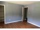 Bedroom features wood-look flooring, two closets and gray walls at 1431 Cherrycrest Dr, Durham, NC 27704