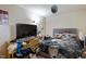 Cluttered bedroom with unmade bed, dresser with miscellaneous items, and disco ball at 1431 Cherrycrest Dr, Durham, NC 27704