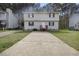 Traditional two-story home featuring a large driveway and a quaint front entrance at 1431 Cherrycrest Dr, Durham, NC 27704