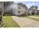 A two-story home with tidy landscaping and a private drive on a sunny day at 1431 Cherrycrest Dr, Durham, NC 27704