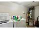 Laundry area with a standard washer, dryer, and miscellaneous cleaning supplies at 1431 Cherrycrest Dr, Durham, NC 27704