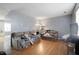 Bright living room with wood floors and a comfortable seating area at 1431 Cherrycrest Dr, Durham, NC 27704