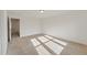 Bright bedroom featuring neutral carpet and a single light fixture at 1431 Goldsboro Ave, Sanford, NC 27330