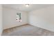 This carpeted bedroom has a window that lets in natural light at 1431 Goldsboro Ave, Sanford, NC 27330