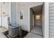 Back of a townhouse with gray siding and an HVAC unit on the side at 1431 Goldsboro Ave, Sanford, NC 27330