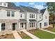 Beautiful townhouse exterior with stone accents and well-maintained landscaping at 1431 Goldsboro Ave, Sanford, NC 27330