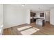 Open layout showcasing modern kitchen with island and stainless steel appliances at 1431 Goldsboro Ave, Sanford, NC 27330