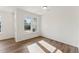 Well-lit room with wood-look flooring and large windows offering neighborhood views at 1431 Goldsboro Ave, Sanford, NC 27330