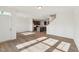 Bright living space with wood-look floors leading into a modern kitchen area at 1431 Goldsboro Ave, Sanford, NC 27330