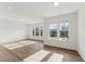 Bright, spacious living room featuring large windows and modern recessed lighting at 1431 Goldsboro Ave, Sanford, NC 27330