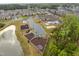 Community amenities with a pool, playground, and recreational areas surrounded by townhomes at 1726 Wimberly Rd, Apex, NC 27523
