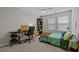 Bright bedroom with a desk area and a comfortable bed, ideal for relaxation and study at 1726 Wimberly Rd, Apex, NC 27523
