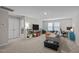 Spacious flex room with carpet, comfortable seating, television, and desk at 1726 Wimberly Rd, Apex, NC 27523