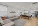 Open-concept living space with a sectional sofa, dining area, and modern kitchen at 1726 Wimberly Rd, Apex, NC 27523
