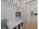 Welcoming mudroom with built-in bench, storage shelves, hooks, and neutral decor at 1726 Wimberly Rd, Apex, NC 27523