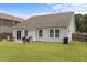 Nice backyard features a well-manicured lawn, a cozy patio setup, and ample space for recreation and enjoyment at 1728 Fern Hollow Trl, Wake Forest, NC 27587